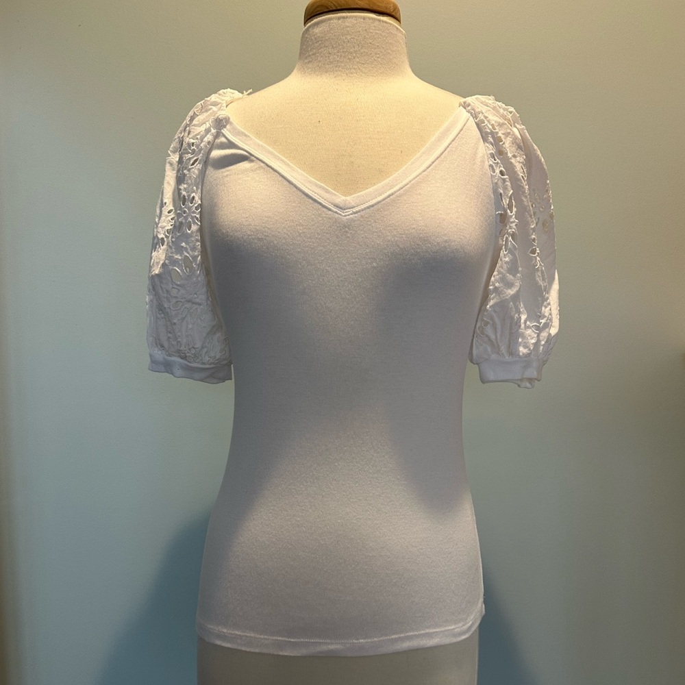 a loves a white eyelet puff sleeve shirt. Size Small